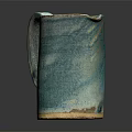 Handcrafted Turquoise Ceramic Cup With Textured Surface And Unique Design On Dark Background