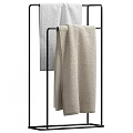 Soft Beige Cotton Bath Towels Hanging On Metal Rack For Bathroom Use