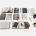 Assorted Open And Closed Notebooks With Pens Pencils Coffee Mug And Stationery
