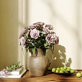 Vase with Purple Roses on Wooden Cabinet and Green Fruits Book White Curtains Sunlight Shadows