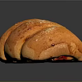 Freshly Baked Golden Curved Bread With Sesame Seeds And Shiny Crust