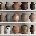 Ceramic Vessels With Various Shapes Colors And Textures Displayed On White Shelves