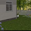 Beautiful Garden With White House Window White Fence Green Lawn And Purple Flowers