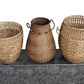 Three Brown Woven Storage Baskets Displayed on a Black Countertop 3d model