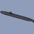 Modern Military Submarine With Dark Hull And Conning Tower Floating On Blue Sea Surface