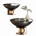 Bowl Shaped Black Coffee Table with Golden Sphere Base and White Vase Holding Flowers