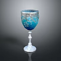Elegant Blue Glass Goblet With Silver Floral Patterns And White Base