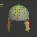 Vintage Ornate Metallic Helmet With Colorful Gemstones And Carved Details