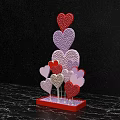 Romantic Photo Spot With Colorful Sparkling Heart Decorations On Red Base