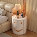White Bedside Table With Smiley Face Drawers Lamp Radio And Small Plate In Bedroom