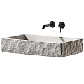 Textured Stone Washbasin Design with Modern Black Faucets and Minimalist Style