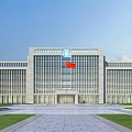 Modern Office Building With Red Flag Lawn Walkway And People Walking