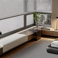 Modern Bay Window Seat With White Blinds Green Plant Small Table Table Lamp And Bed