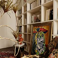 Modern Study Room Interior With Bookshelves Colorful Painting Gold Plant And Decorative Sculpture