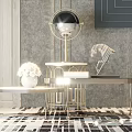 Elegant Modern Coffee Table With Gold Metal Frame Glass Top And Decorative Sculpture On Rug