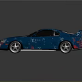 Blue Sports Car with Rear Spoiler Black Windows Silver Wheels and Glossy Sleek Body Finish