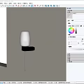 Modern Wall Light With Transparent Glass Shade And Silver Metal Base Mounted On White Wall
