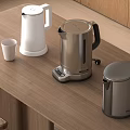 Wooden Kitchen Countertop With White Silver Kettles And Small Cup