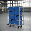 Multi tiered Industrial Cart With Blue Containers And Wheels In Industrial Facility