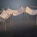 Three Simple Tents Made With Natural Wooden Sticks And Light Colored Fabric
