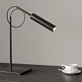 Minimalist Black Desk Lamp With White Coffee Cup On Wooden Table