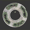 Circular Garden Sculpture with Central Water Pool Surrounding Flower Beds Green Plants and Pink Flowers