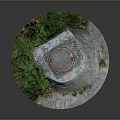 Manhole Cover On Concrete Base With Surrounding Green Grass Growth