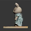 Cute Rabbit Doll Wearing Floral Green Dress Standing On Wooden Platform