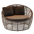 Round Rattan Outdoor Sofa With Dark Cushions And Light Brown Seat Design