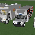 Different Types of Recreational Vehicles and Trailers Parked on Green Grass