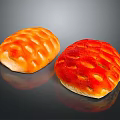 Two Freshly Baked Artisan Bread Loaves With Golden And Red Crusty Surface Patterns