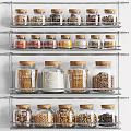 Organized Kitchen Spice Jars Storage With Multi Tier Metal Shelf And Clear Glass Containers 3d model