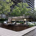 Urban Garden Landscape Design With Trees Benches and Green Plant Seating Area