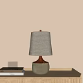 Beige Fabric Shade Table Lamp With Orange Neck Grayish Green Ceramic Base On Wooden Tray