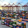 Busy Modern Container Port With Stacked Colorful Cargo Containers And Large Harbor Gantry Cranes