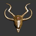 Golden Decorative Animal Skull with Curved Horns and Red Gemstone on Forehead