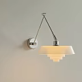 Modern Minimalist Wall Lamp on Light Wall with Silver Bracket and White Multi Layer Lampshade