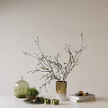 Decorative Ornament Set Featuring Flowering Branch Vase Green Glass Bottle Small Plant And Golden Accent