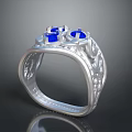 Silver Ring With Blue Gemstones And Intricate Carvings On Band