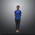 Woman Standing Barefoot In Blue Polo Shirt And Black Pants Against Gray Background
