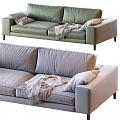 Modern Green And Light Gray Two Seater Sofa With Pillows And Blanket