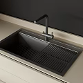 Sleek Black Kitchen Sink With Modern Faucet On Light Colored Countertop