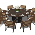 Round Wooden Dining Table and Eight Chairs Set with Flower Centerpiece and Place Settings