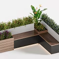 Decorative Flowers And Green Plants In Modern L Shaped Planter With Wooden Bench