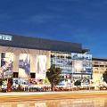 Modern Commercial Complex Street View With Glass Curtain Wall Billboards Night Lighting Pedestrians And Trees