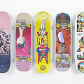 Colorful Skateboards With Unique Graphics And Various Designs In Pink Gray Yellow Blue White