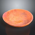 Artisanal Hand Carved Orange Clay Bowl With Intricate Decorative Surface Patterns And Smooth Edges