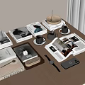 Stylish Stacked Books And Open Magazines On Tabletop With Coffee Cups Watch And Mobile Phone