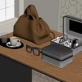Golden Leather Bag And Gray Jewelry Storage Box On Wooden Table With Coffee Cup
