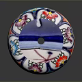 Colorful Circular Carved Sculpture With Floral Patterns And Blue Decorative Lid